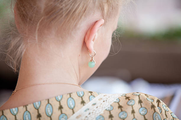 Nape of young blonde girl in retro dress stock photo