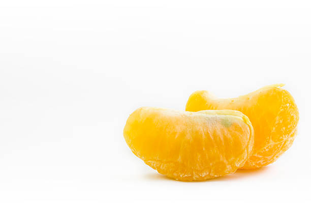 istock pieces of orange on white background, text caption 530601231