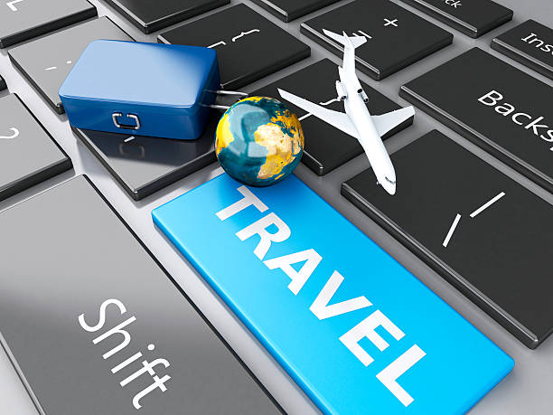 istock suitcase, airplane and earth on computer keyboard. Travel concept 530602641