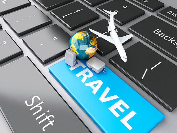 istock suitcase, airplane and earth on computer keyboard. Travel concept 530603301