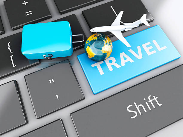 istock suitcase, airplane and earth on computer keyboard. Travel concept 530603367