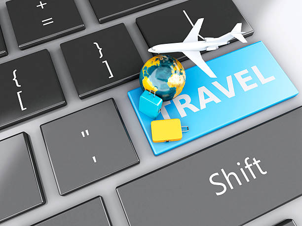 istock suitcase, airplane and earth on computer keyboard. Travel concept 530603379