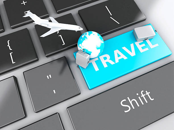 istock suitcase, airplane and earth on computer keyboard. Travel concept 530603771