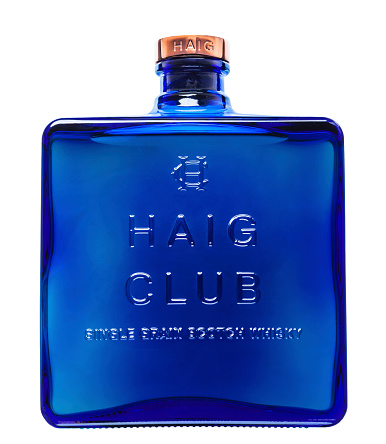 Huntly, United Kingdom - December 29, 2014: A 70cl bottle of Haig Club single grain scotch whisky. Introduced in autumn 2014 with an advertising campaign fronted by David Beckham, this single grain whisky is aimed at a sophisticated, younger market. Produced by the Diageo company at its Cameronbridge distillery in Fife, Scotland in a distinct blue bottle reminiscent of an item of perfumery, the liquid has a lighter taste which is much easier on the palate than some of the smokey peaty offerings of the Scottish Islands.