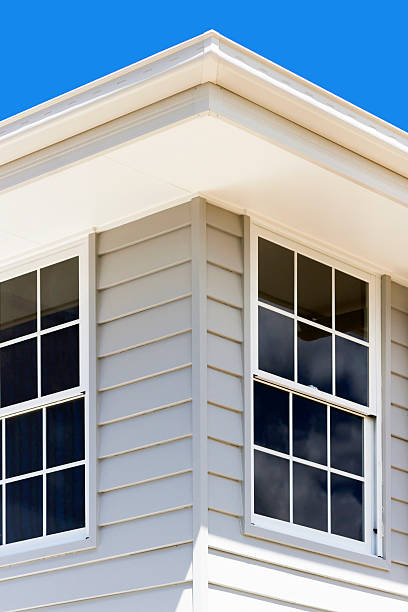 istock Closeup corner of modern house against blue background 530612725
