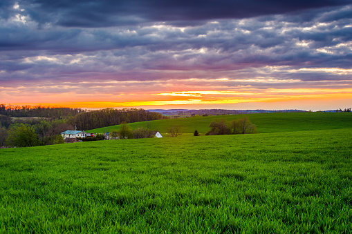 Sunset over farm fields in rural York County, Pennsylvania.