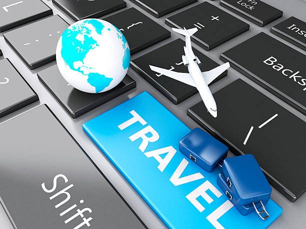 istock suitcase, airplane and earth on computer keyboard. Travel concept 530614877