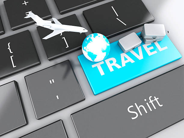 istock suitcase, airplane and earth on computer keyboard. Travel concept 530614885