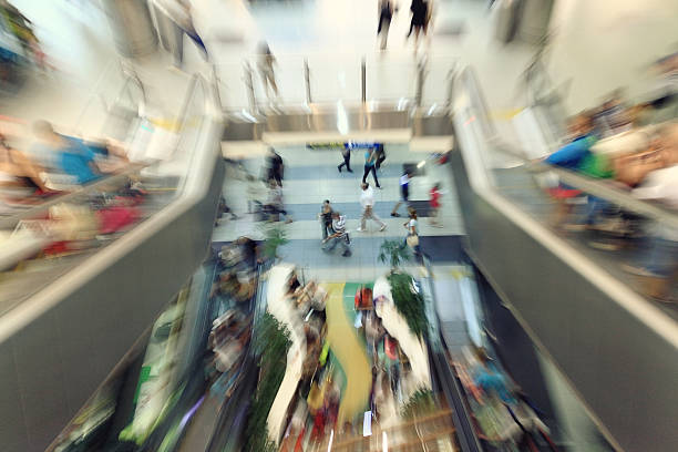 istock motion blurred people in the mall speed 530616181