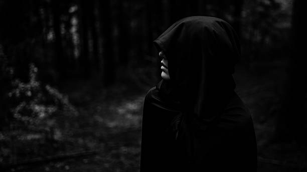 Demon in forest. Grim reaper in search of his victim. stock photo