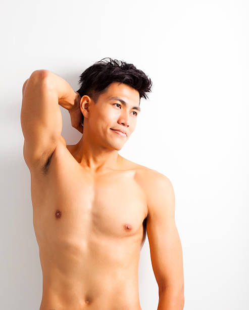 istock smiling shirtless muscular young asian man 530618941