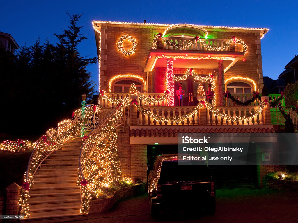 Luxury Brooklyn House with Christmas Lights at sunset, New York. New York,  NY, USA - December 26, 2014: Luxury Home with Christmas Lights in Bay Ridge neighbourhood of Brooklyn, New York. The image taken at sunset. Wide angle lens. American Culture Stock Photo