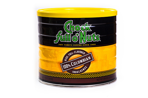 New York City, New York, USA - August 13, 2014: Can of Chock Full O Nuts Columbian ground coffee against white background. Chock full o'Nuts is a brand of coffee originating from a chain of New York City coffee shops founded by William Black. 