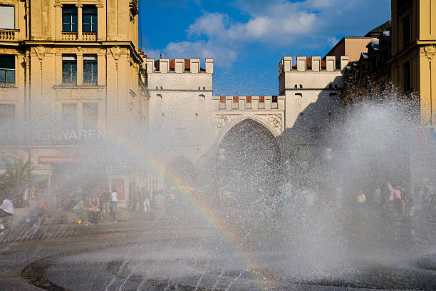 Germany, Bavaria, Munich, Karlsplatz, fountain in foreground