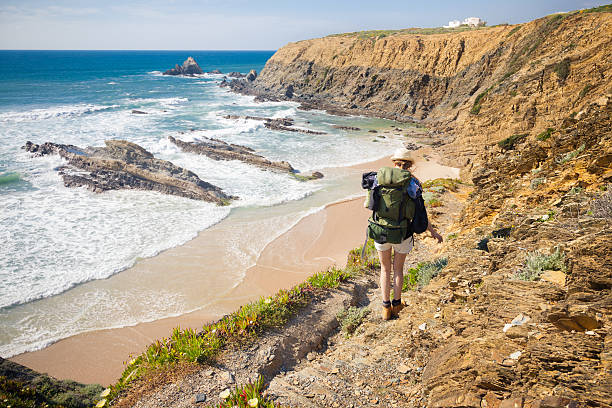 hiker on hiking trail  along coast portugal , rota vicentina. HDR image