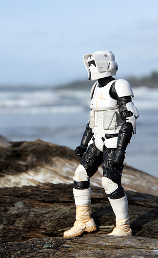 Tofino, Canada - November 4, 2014: A Scout Trooper from the Star Wars film franchise on the beach at Tofino. The toy is part of the Black Series, from Hasbro.