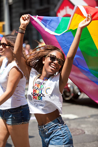 New York Gay Pride March New York, USA - June 29th 2014: The New York City Pride March commemorating the gay rights movement. The New York gay pride march is the oldest gay pride march in the world. lesbian pride stock pictures, royalty-free photos & images