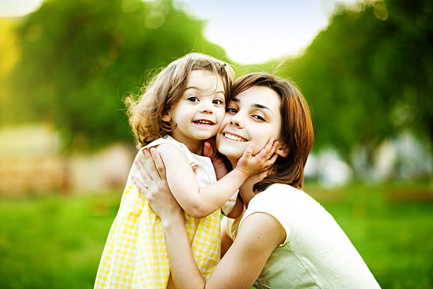 istock Mother and her little daughter smiling 530631225