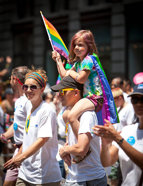New York Gay Pride March New York, USA - June 29th 2014: The New York City Pride March commemorating the gay rights movement. The New York gay pride march is the oldest gay pride march in the world. transgender mom stock pictures, royalty-free photos & images