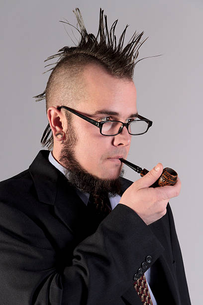 istock Non-comformist Businessman smoking a pipe. 530635317