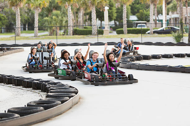 istock Group of teens riding go carts 530635399