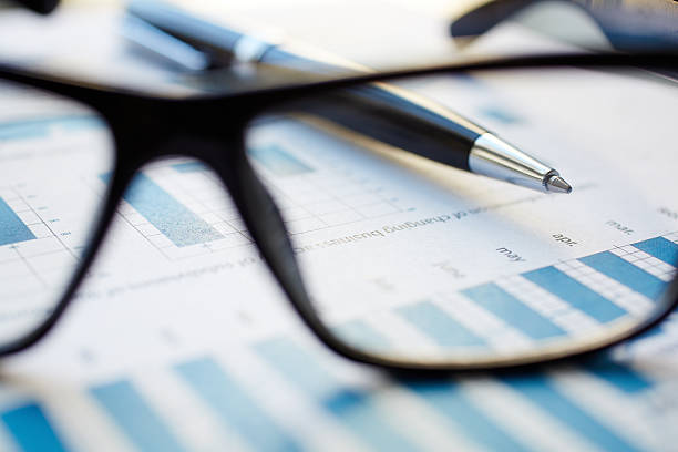 istock Eyeglasses, paper and pen 530636831