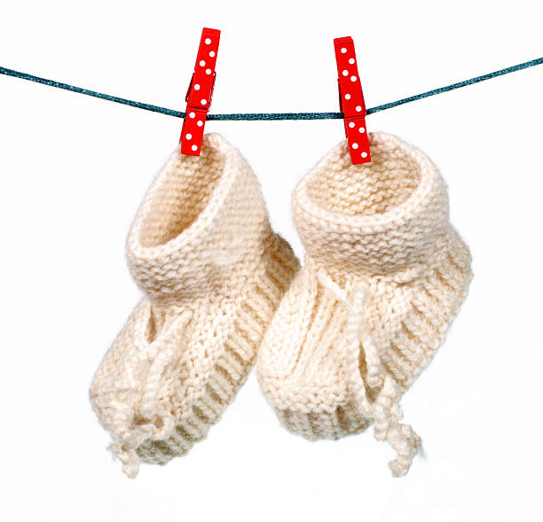 istock baby socks hanging on a cord 530639053