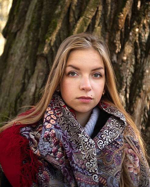 istock Girl with her blond hair on background autumn trees 530640887