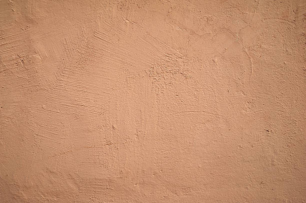 istock Texture of old wall covered with pink stucco 530642139