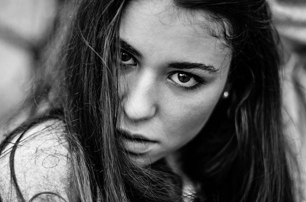 istock Black and white girl look front camera brunette 530645889