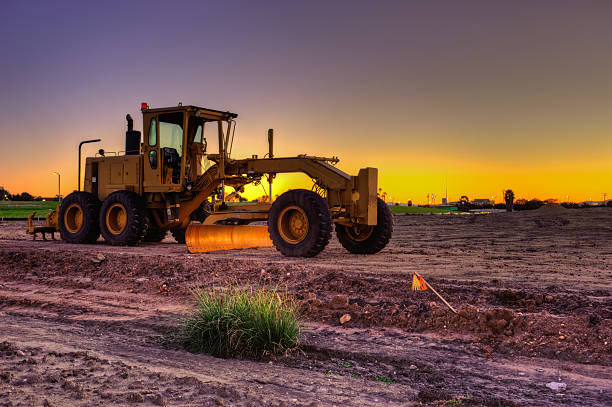istock Lone road grader on the jobsite 530645907