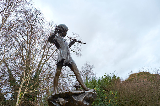 LONDON, UK - DECEMBER 23: Detail of statue of Peter Pan. December 23, 2014 in London. The sculpture, by Sir George Frampton, was placed in Kensington Gardens in 1912.