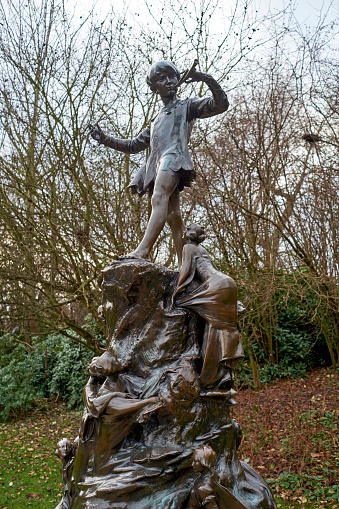 LONDON, UK - DECEMBER 23: Detail of statue of Peter Pan. December 23, 2014 in London. The sculpture, by Sir George Frampton, was placed in Kensington Gardens in 1912.