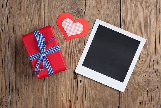 istock Instant photo with gift and hearts 530649281