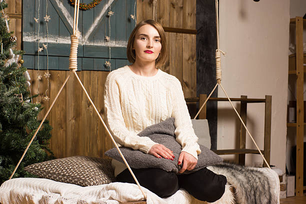 istock Beautiful girl in a sweater with rustic interior 530649651