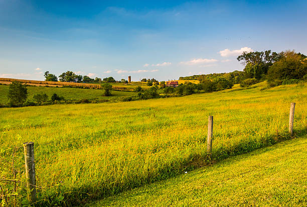 Fence and farm field in rural Howard County, Maryland. stock photo