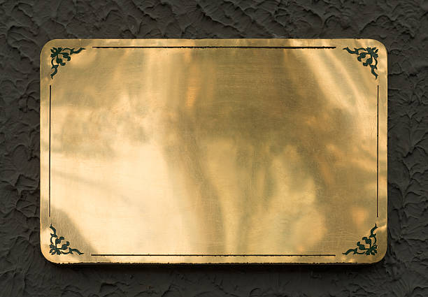 Shiny brass yellow metal sign plate texture isolated with clipping path