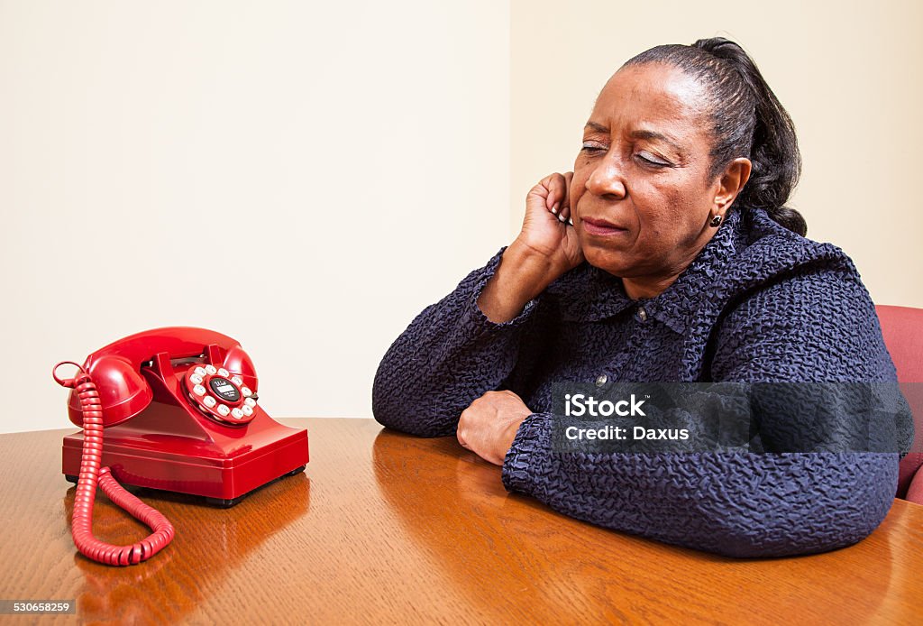 Lady on the Phone Lady talking on the telephone and looking into the camera - Stock Image (CB5) 2015 Stock Photo