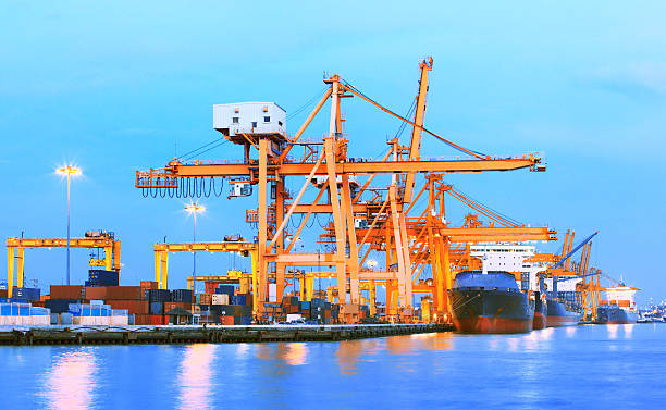 istock heavy crane tool in ship port 530660561