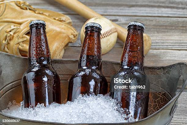 Ice Cold Bottle Beer And Baseball Stuff Stock Photo - Download Image Now - Beer - Alcohol, Bucket, Alcohol - Drink