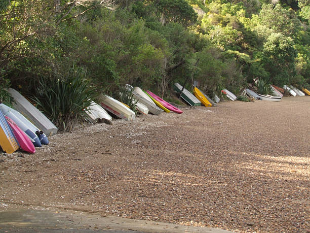 Small boats lined up at a beach stock photo