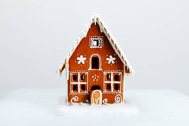 istock The hand-made eatable gingerbread house and snow decoration 530667769