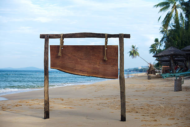istock Advertising board on tropical beach 530667907