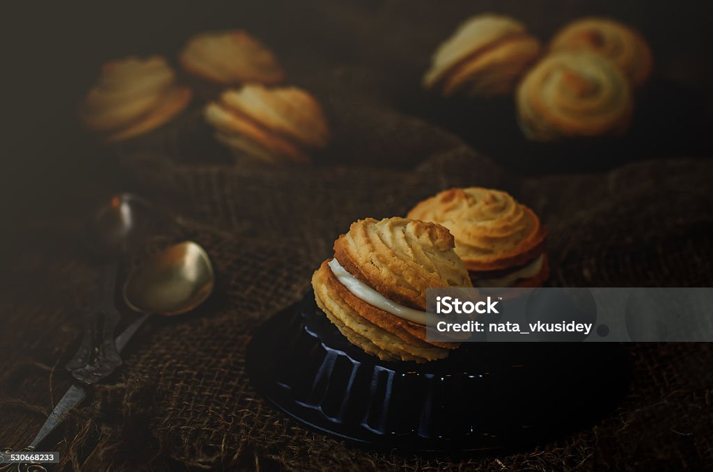 shortbread with cream cheese shortbread with cream cheese on a dark background. tinting. selective focus Aromatherapy Stock Photo