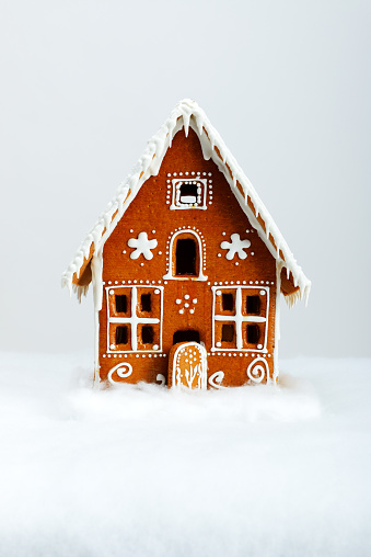 Gingerbread house decorated with icing, sweets and chocolates