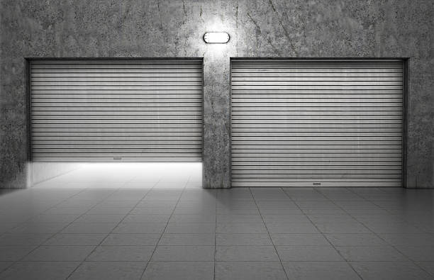 istock Garage building made of concrete with roller shutter doors 530670335