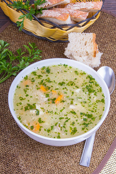 sopa de cebada tradicional en un tazón con pan blanco - vegetable barley soup fotografías e imágenes de stock