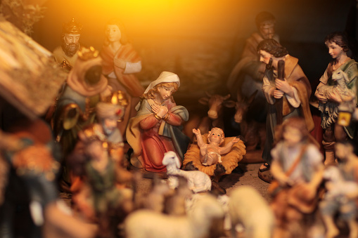 Christmas nativity scene with three Wise Men presenting gifts to baby Jesus