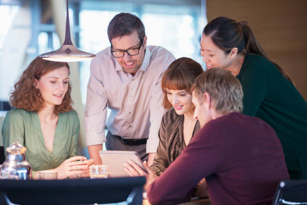istock Business people using digital tablet in office meeting 530681921