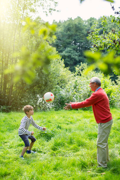 20+ Old Man Throwing Football Stock Photos, Pictures & Royalty-Free ...